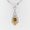 White gold handmade necklace with diamonds and precious center stone from GoldQuestJewelers near Boston MA
