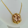 Yellow gold necklace with a precious stone center from GoldQuestJewelers near Boston MA
