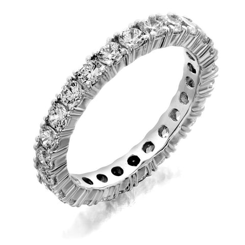 Eternity wedding band with four prong from GoldQuestJewelers jewelry store in Boston