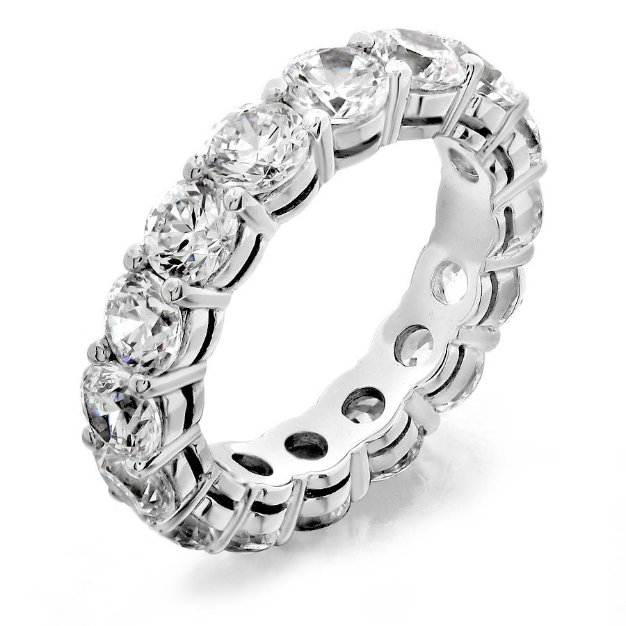 Eternity wedding band with shared prong from GoldQuestJewelers jewelry store in Boston