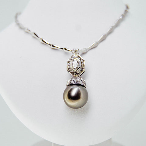 White gold green pearl pendant with diamond from GoldQuestJewelers jewelry store in Boston MA