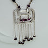 White gold handmade necklace with diamonds and rubies from GoldQuestJewelers near Boston MA