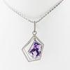 White gold handmade necklace with diamonds and precious stone center from GoldQuestJewelers near Boston MA