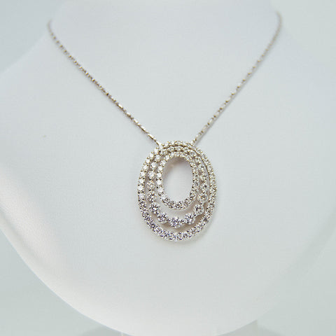 White gold with 3 circles diamond stones necklace from GoldQuestJewelers jewelry store in Boston