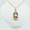Yellow gold double chain with diamond and precious gemstone center from GoldQuestJewelers jewelry store in Boston MA
